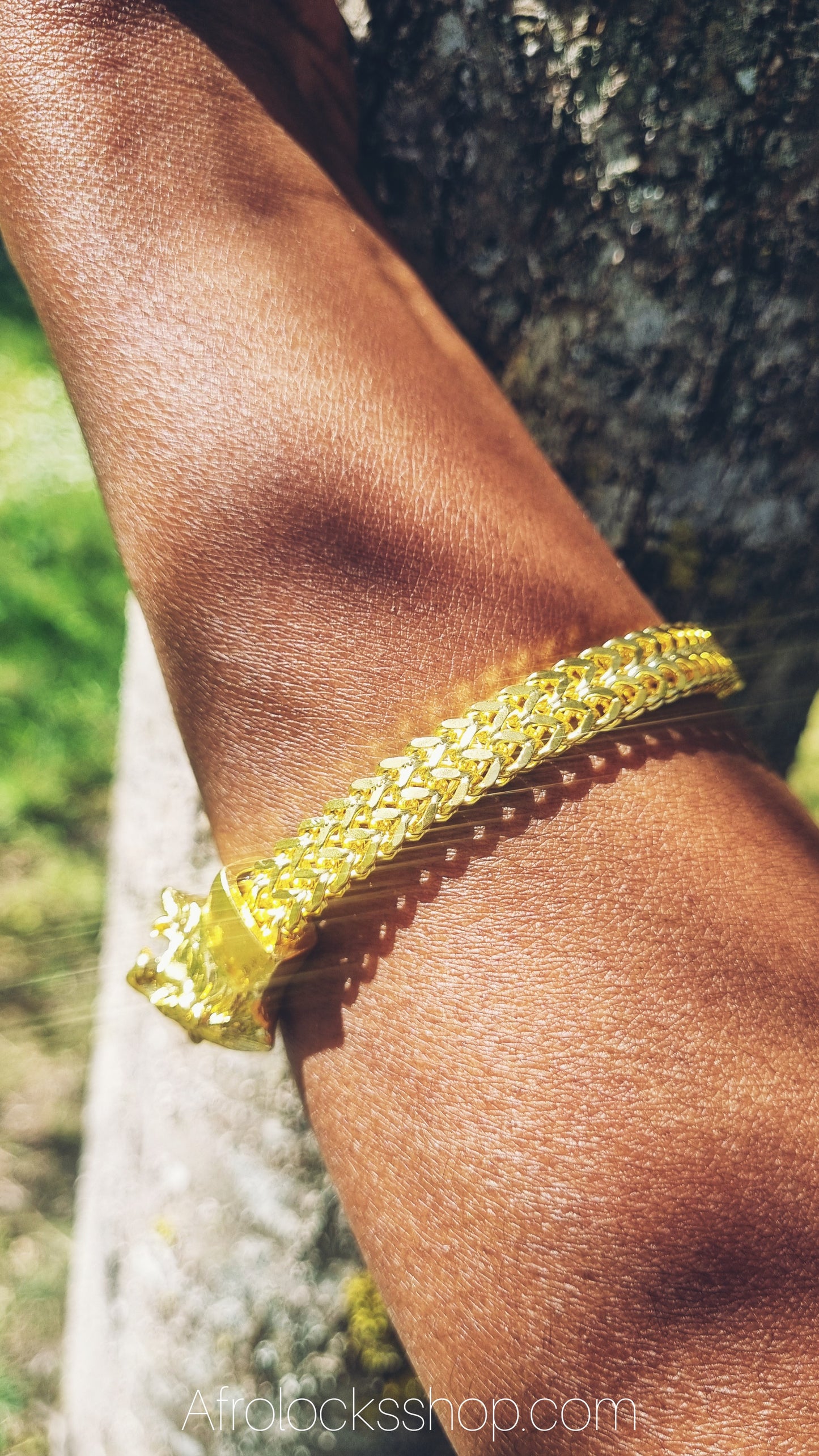 Bracelet en maille gourmette plaqué or et détail tête de lion