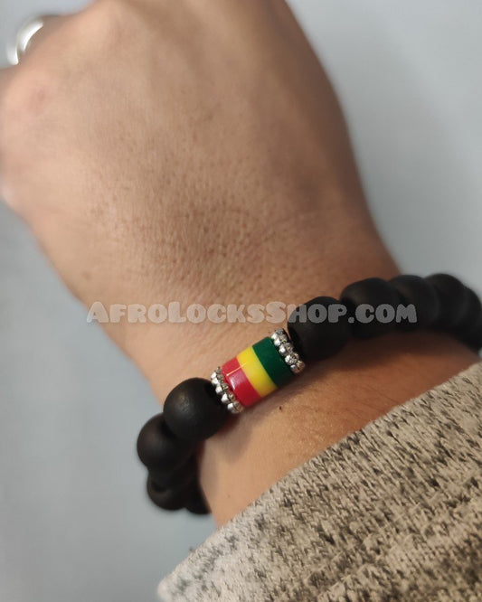 Bracelet en grosses perles noires et aux couleurs rasta
