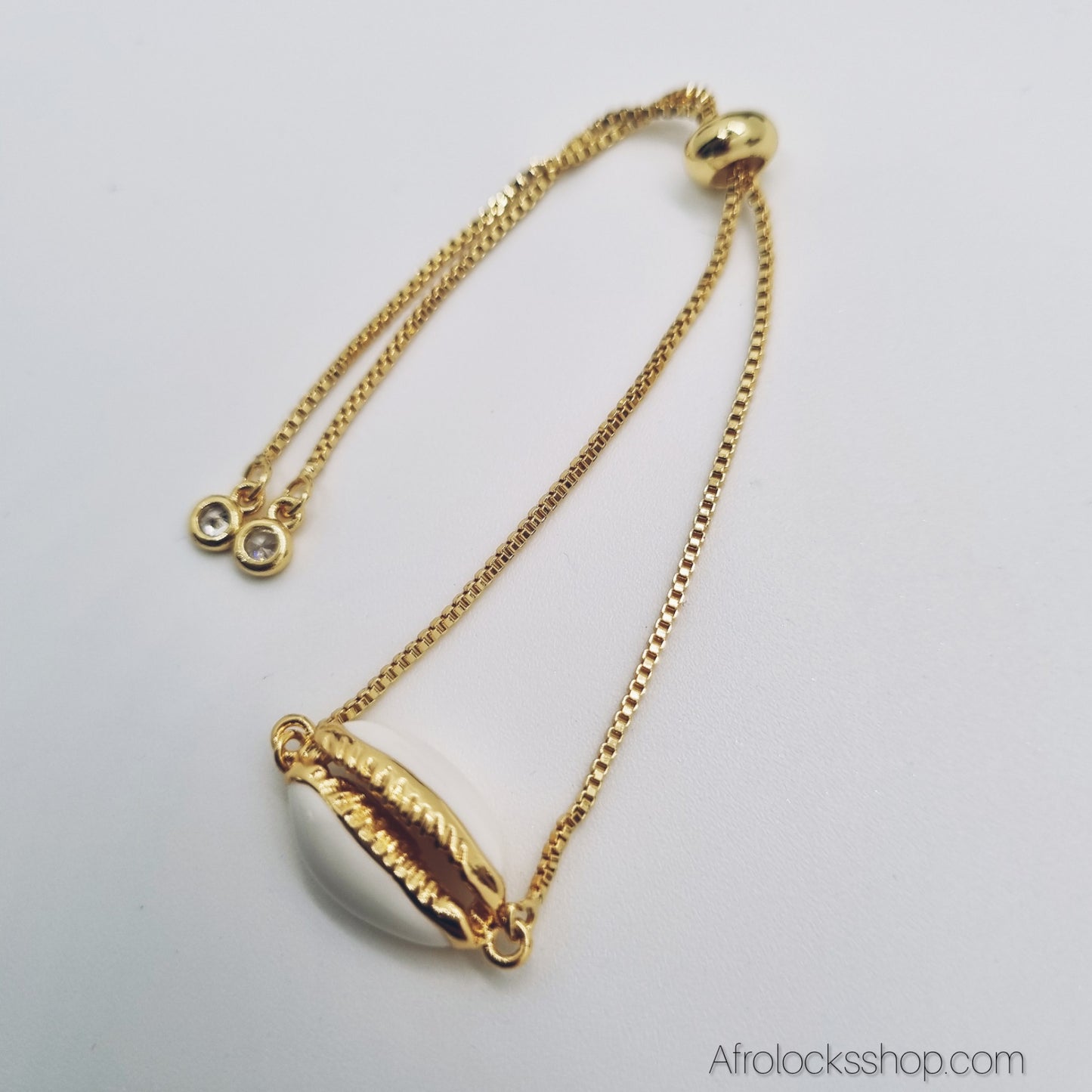 Bracelet cauri synthétique doré – chaîne coulissante ajustable avec pampilles strass