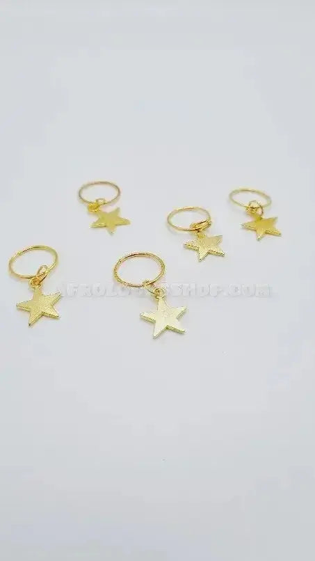 Set of five gold star hair rings for locks and braids on a white background