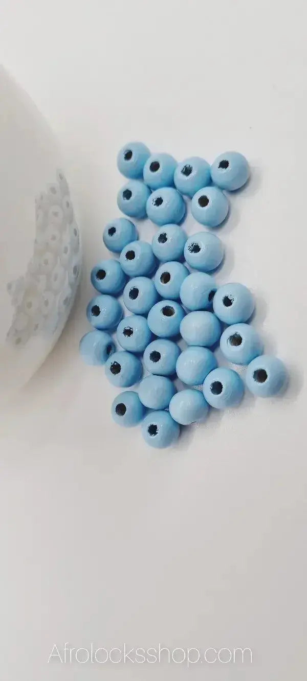 Light blue wooden beads for hair accessories or jewelry on white background