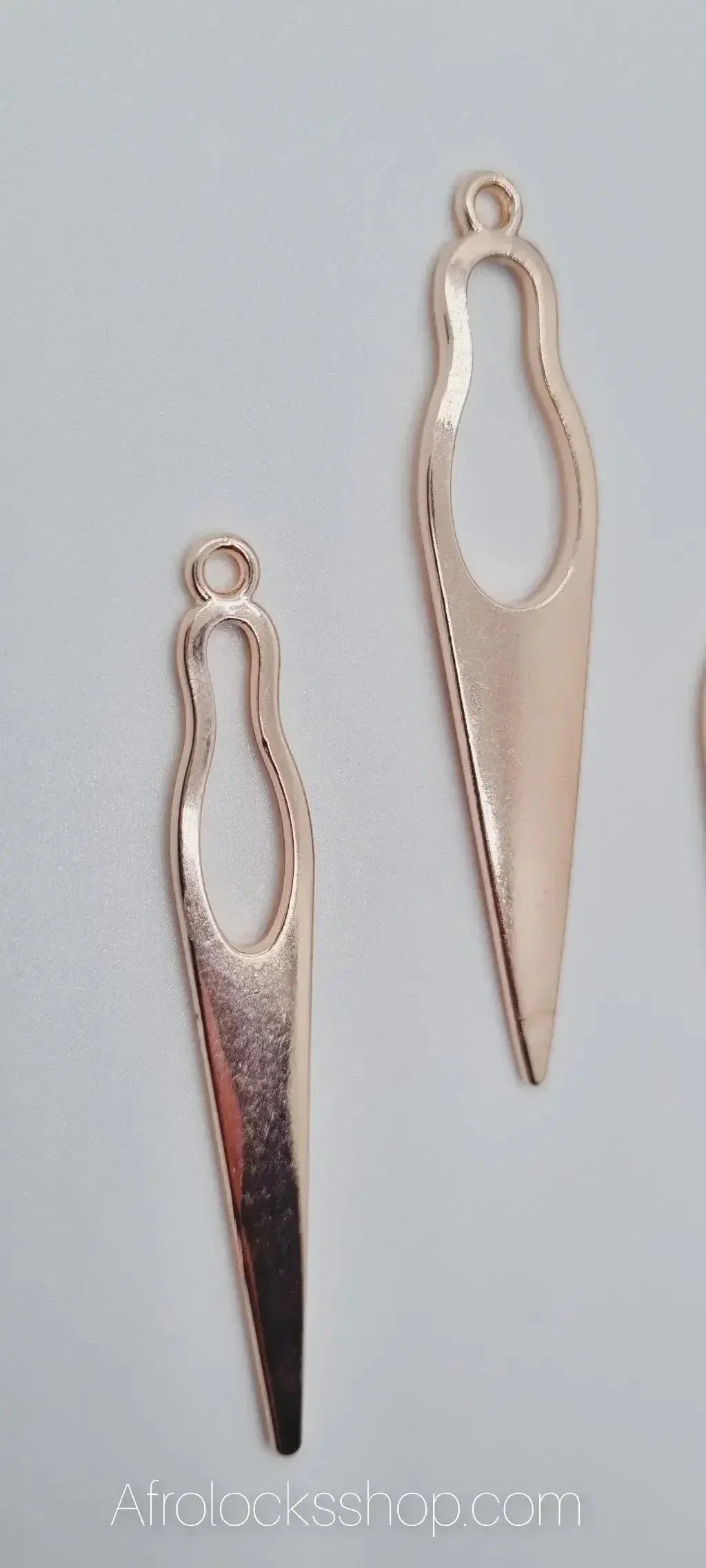 Pair of gold-toned geometric earrings for locs or curly hair accessories