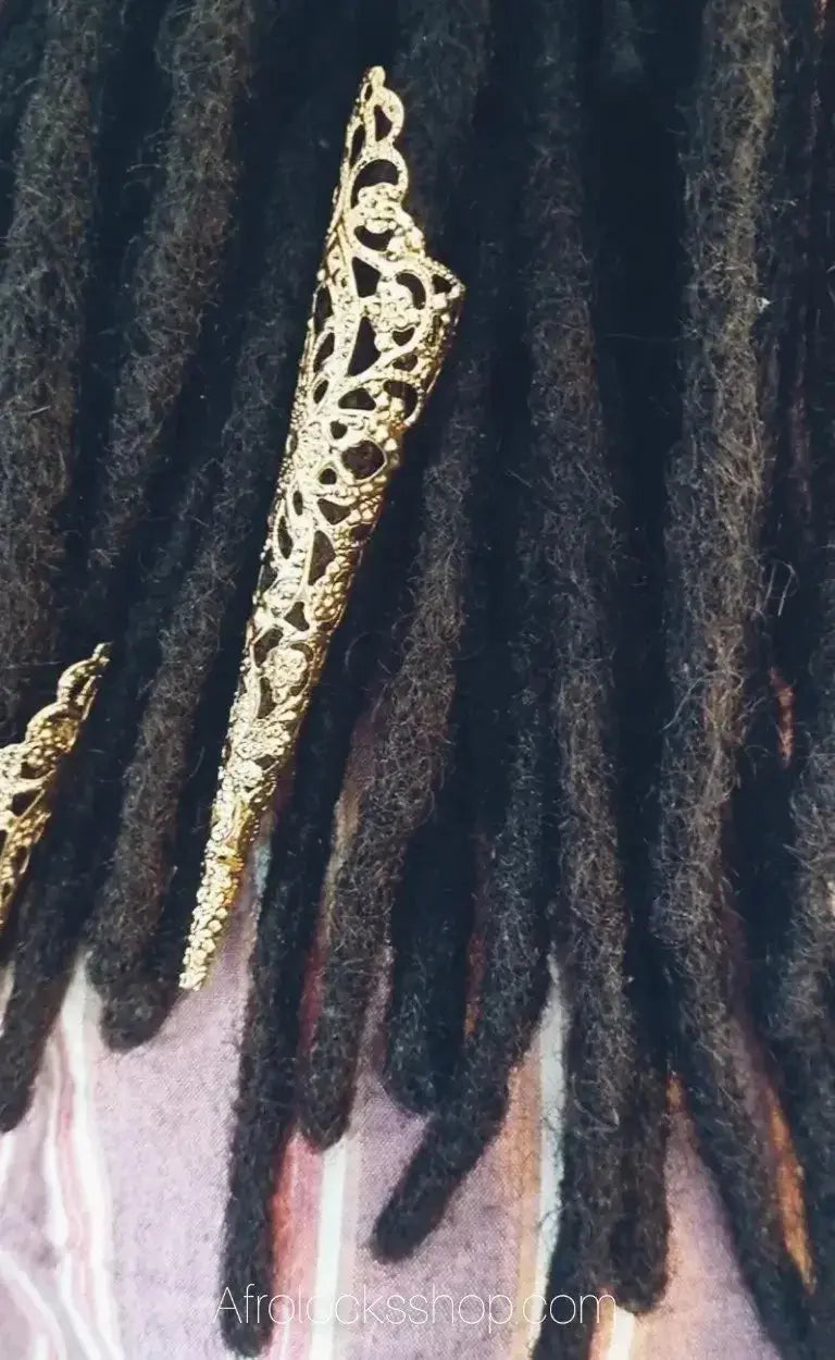 Black dreadlocks with decorative gold hair cuffs for locs and natural hair accessories
