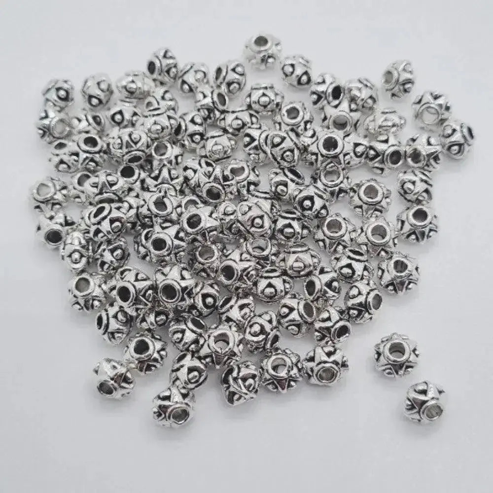 Silver zinc beads 6mm with 2mm hole, set of 100, for microlocks and braids on white background.