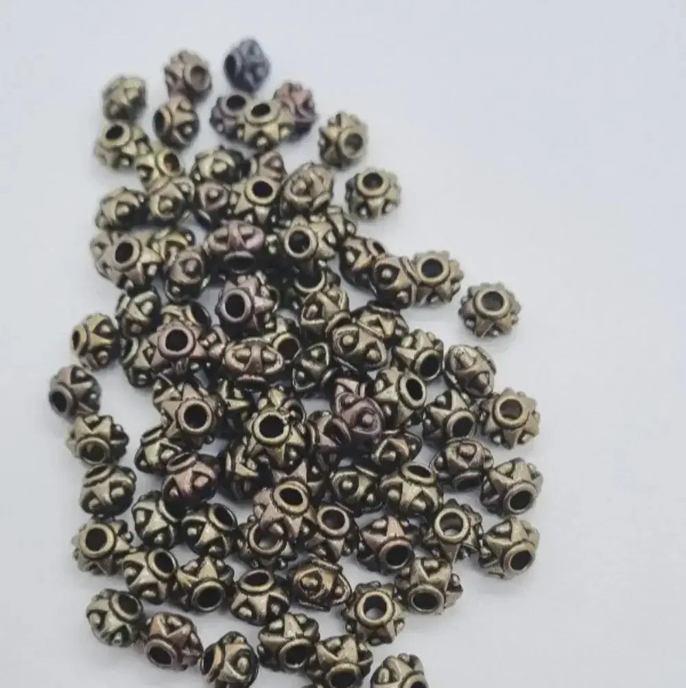 Set of small decorative zinc hair beads for braids, microlocks, and sisterlocks