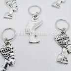 Silver hair jewelry charms shaped like an African queen bust for braids and locs.