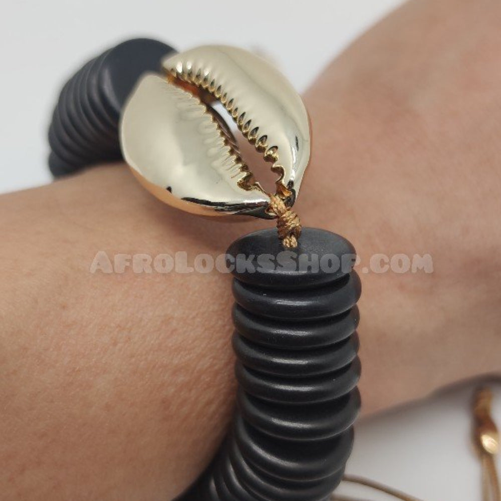 Bracelet noir grand coquillage cauri doré