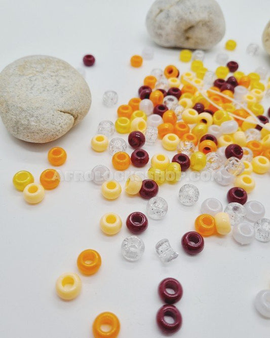 Lot de 150 perles orangées avec son passe-perles en plastique